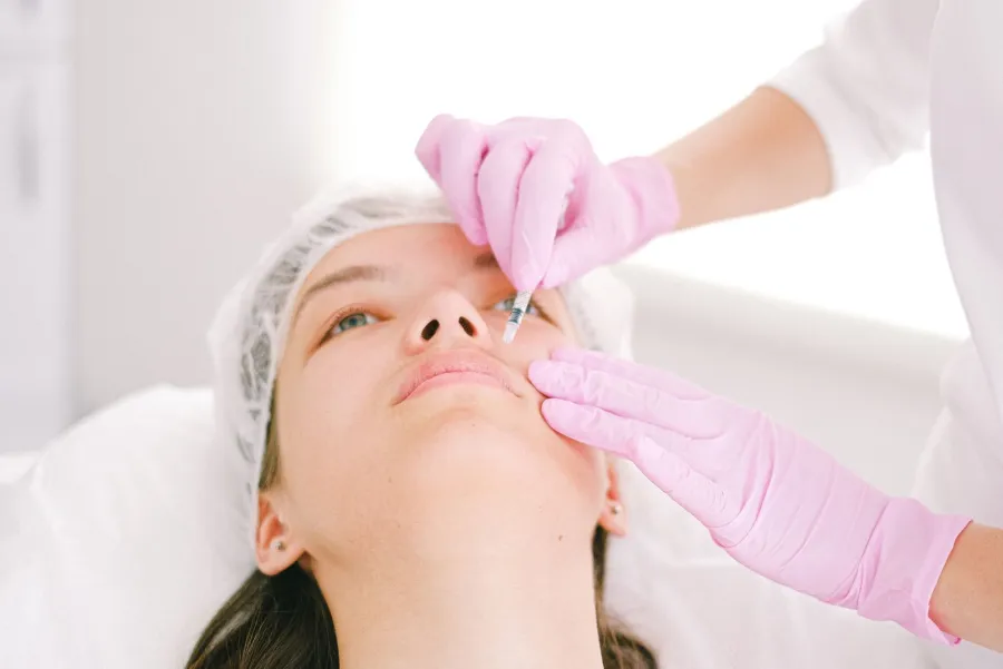 Aesthetic clinic consultation and injection treatment, illustrative image