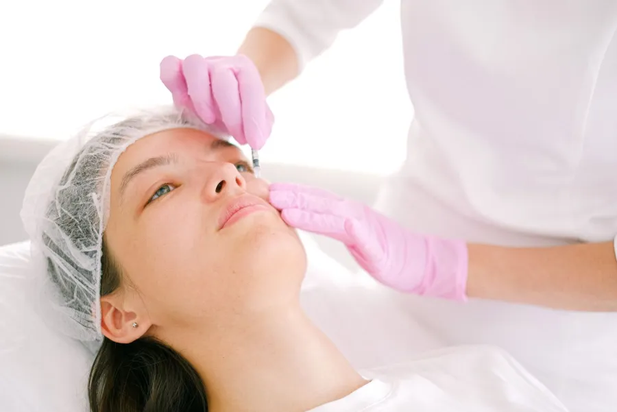 Cosmetic injection treatment in a clinical setting, illustrative image