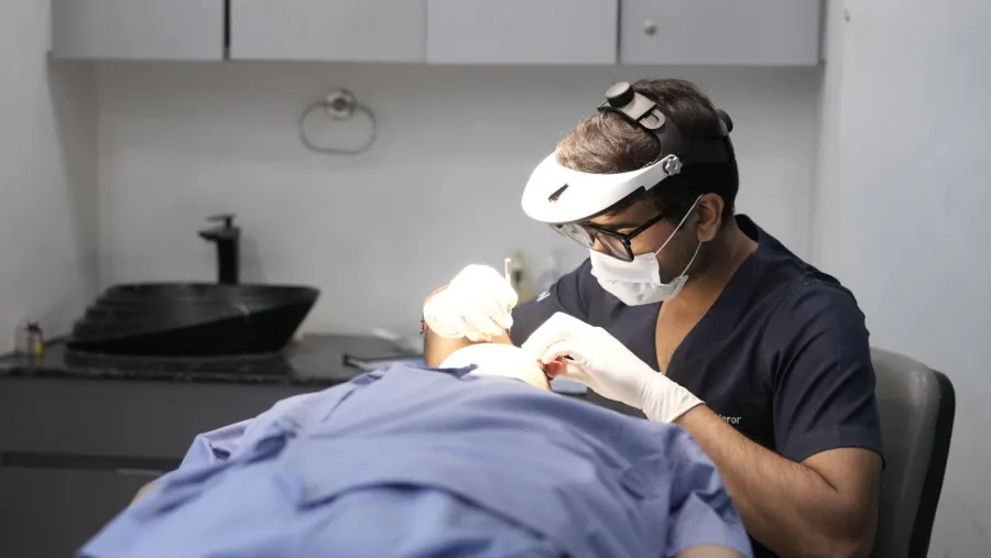 Dermatologist conducting a treatment session in a modern clinic