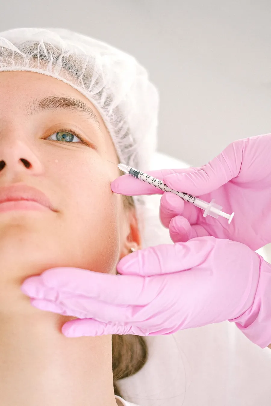 Facial injection treatment by a professional, illustrative image