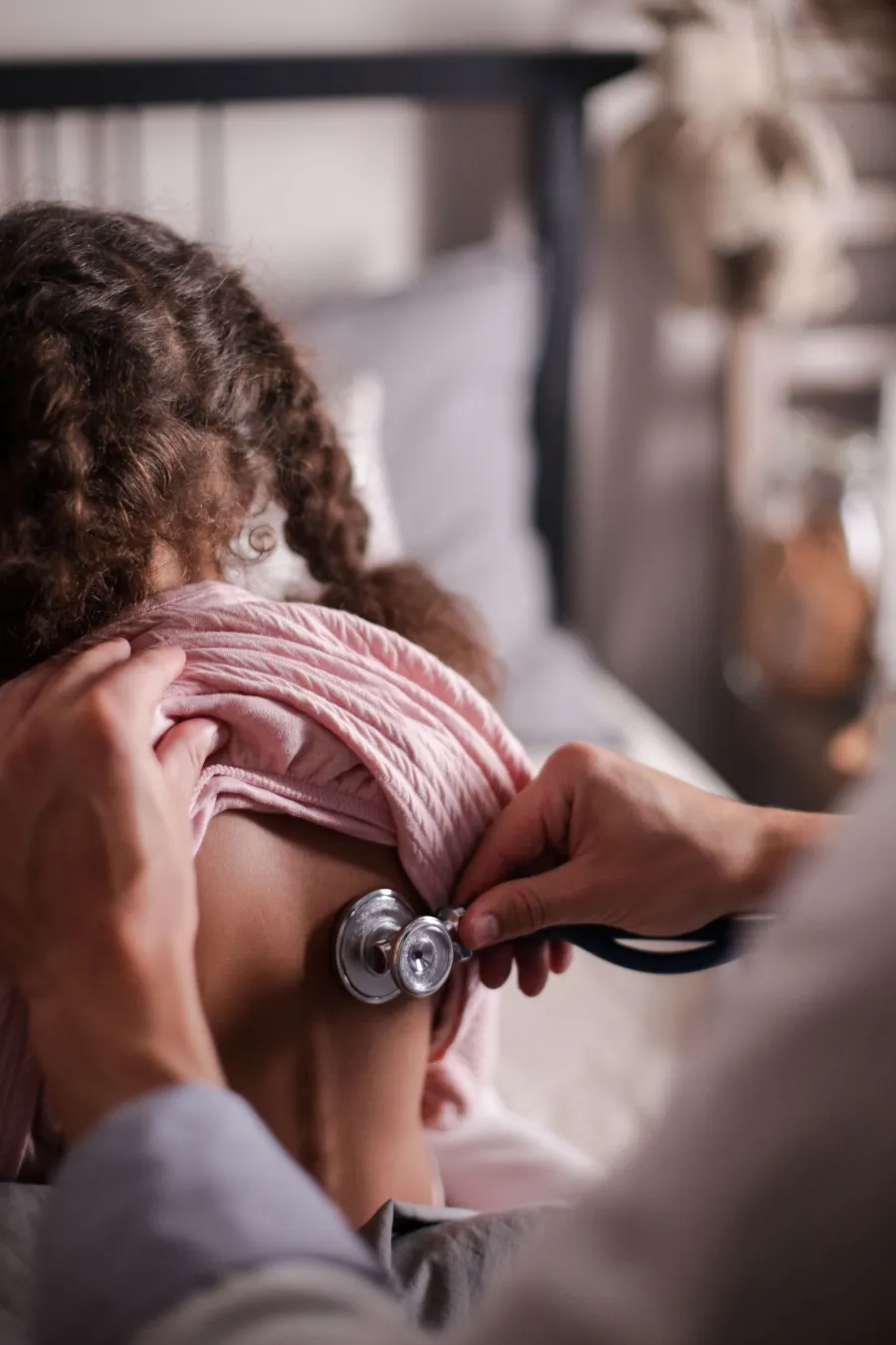 Pediatrician conducting a routine checkup on a young patient