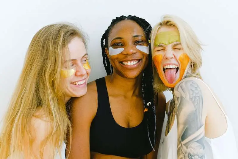 Three women doing facemasks