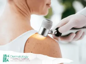 A close-up image of the dermatologist who is examining the patient's skin on the right shoulder