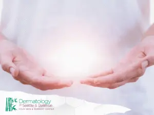 Open hands cupped around a soft glowing light.