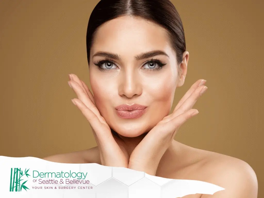 Woman with smooth skin framing her face with both hands.