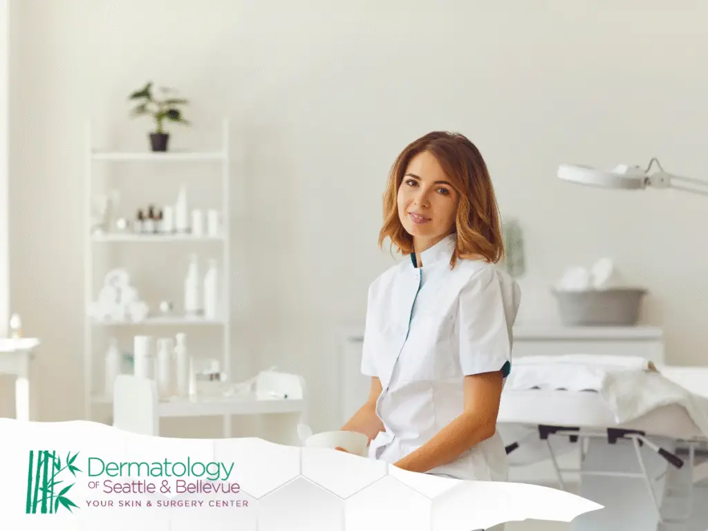 Female medical professional in white coat sitting in bright treatment room