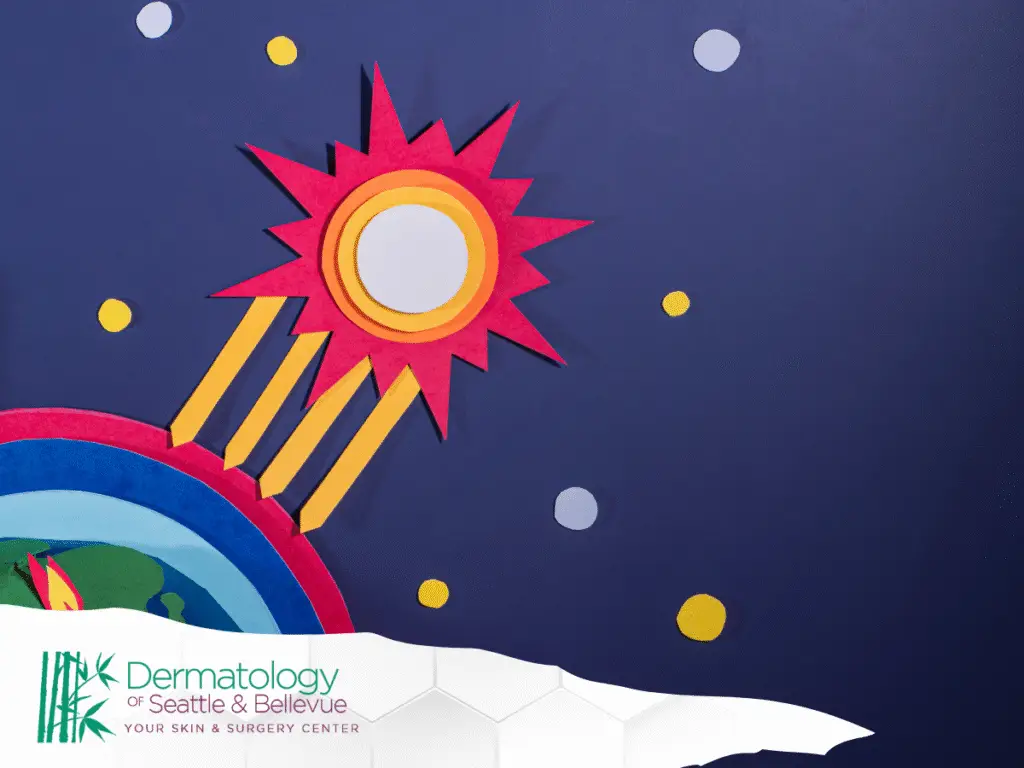 Colorful paper-cut sun and Earth with rays in dark space.